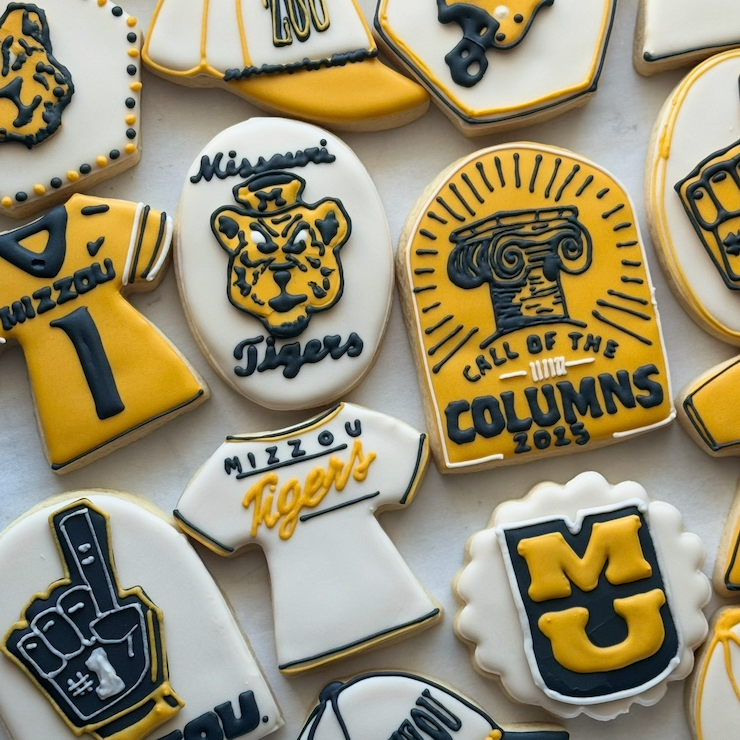 Cookies with various designs including a tiger logo, 'Call of the Columns' text, and 'MU' lettering.