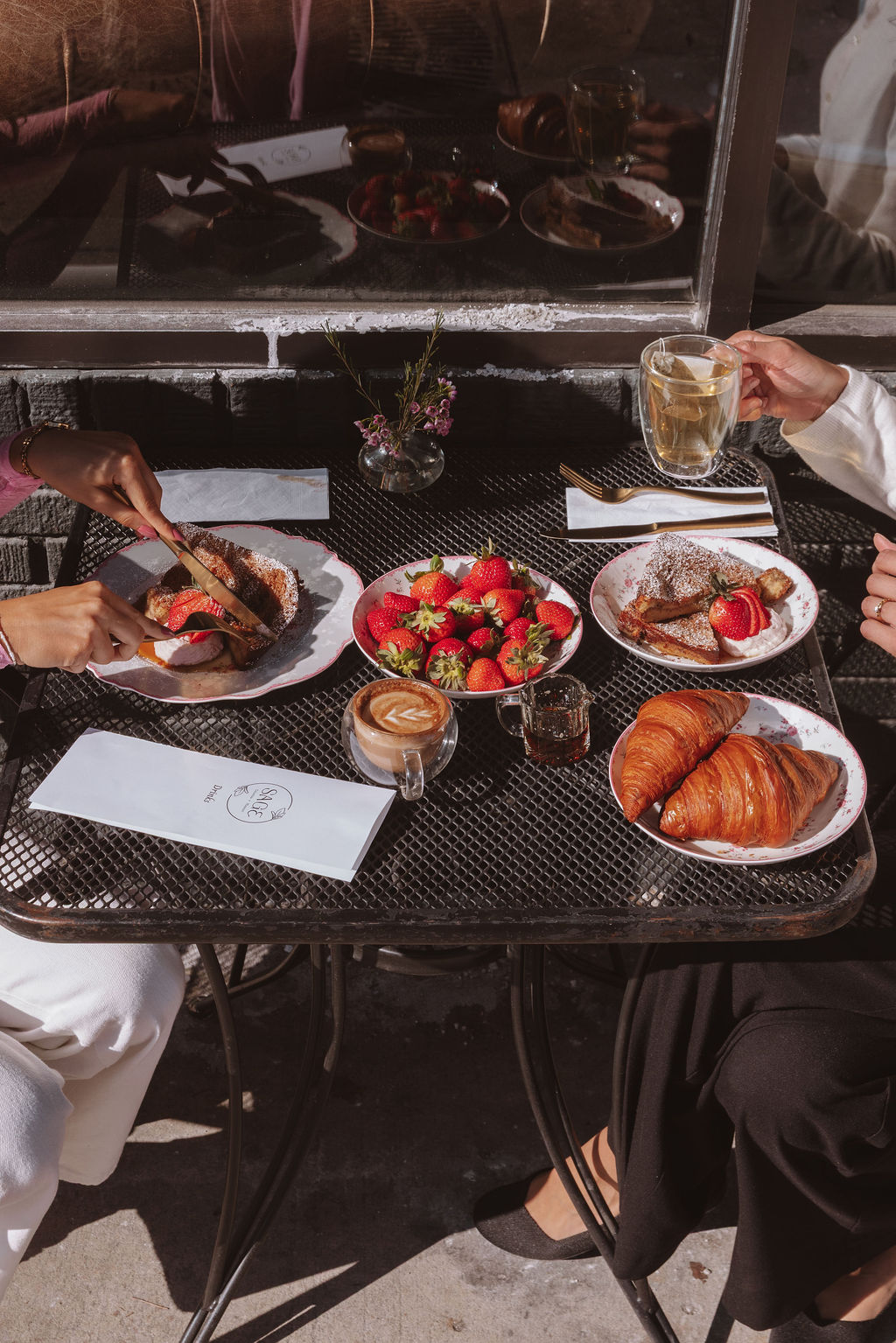Friends sharing brunch on the patio